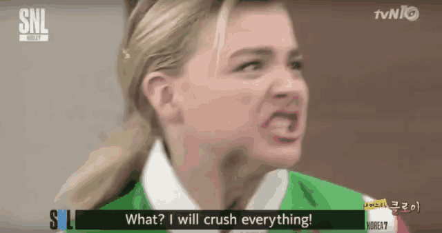 a woman is making a funny face and says " what i will crush everything "