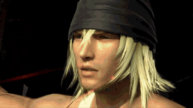 a man with long blonde hair wearing a black bandana
