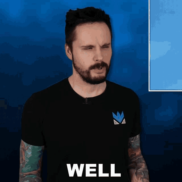 a man with a beard is wearing a black shirt that says well on it