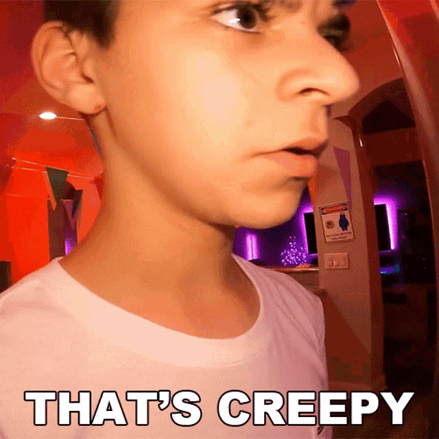 a close up of a person 's face with the words that 's creepy written below it
