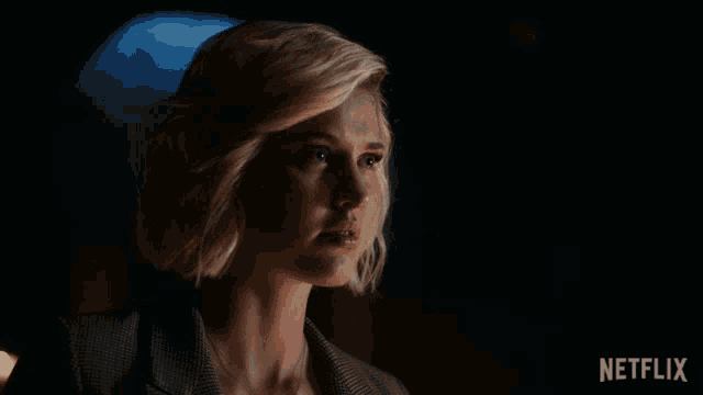 a woman says right in a dark room