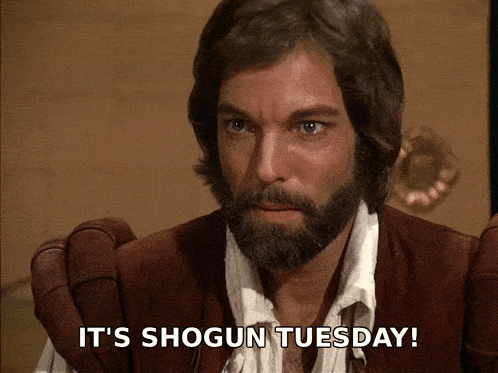 a man with a beard has the words it 's shogun tuesday written below him
