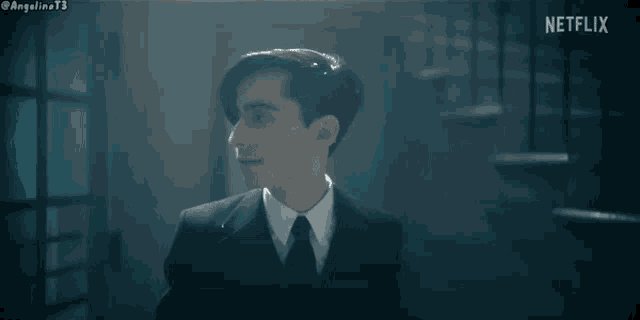 a man in a suit and tie says sorry