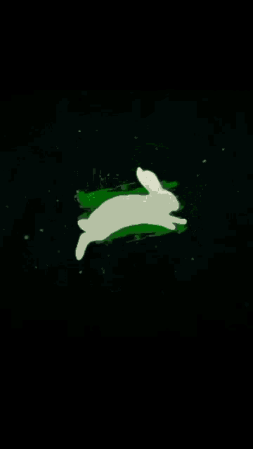 a white rabbit is jumping over a green glowing background .