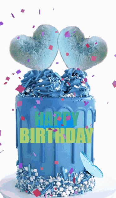 a blue birthday cake with the words happy birthday written in green