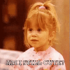 a little girl with a ponytail is asking am i still cute
