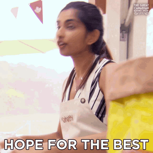 a woman wearing an apron says hope for the best .