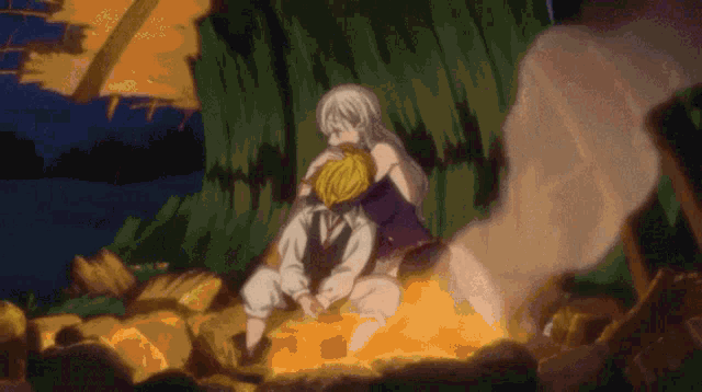 a man and a woman are sitting by a fire