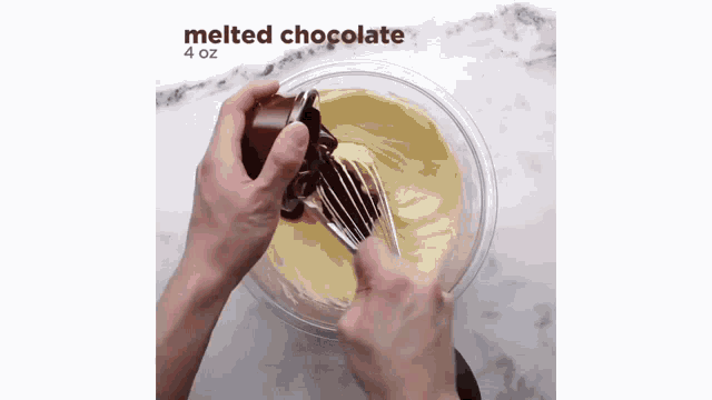 a person is adding melted chocolate to a bowl of batter with a whisk .