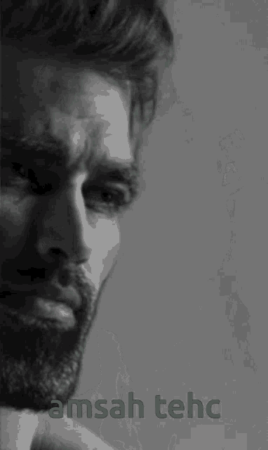 a man with a beard is shown in a black and white photo with the words amsah tehc above him