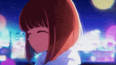 a girl with short hair is smiling in front of a city skyline