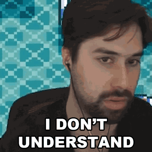 a man with a beard wearing ear buds says i don 't understand