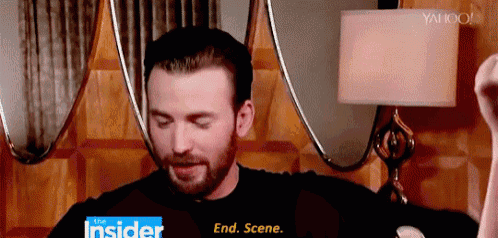 a man with a beard is standing in front of a mirror and a lamp and says " end scene "