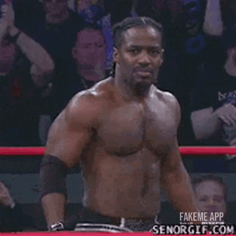 a shirtless man with braids on his hair is smiling .