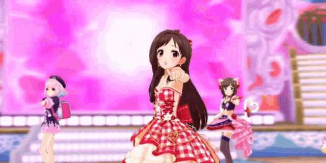 a group of anime girls are standing on a stage .