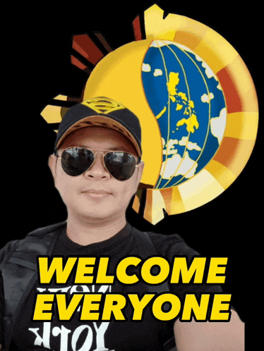 a man wearing sunglasses and a black shirt with the words welcome everyone on it