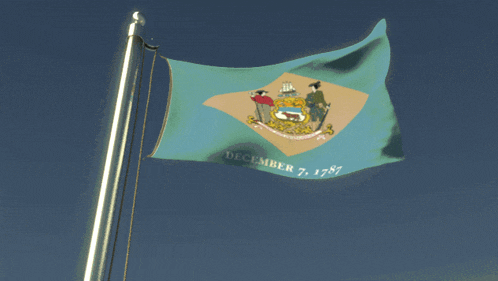 a flag that says december 7 1787 is flying in the wind