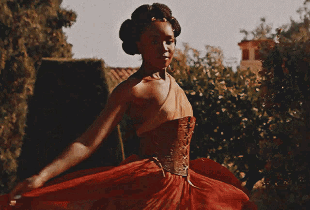a woman 's back is shown with a ponytail and earrings