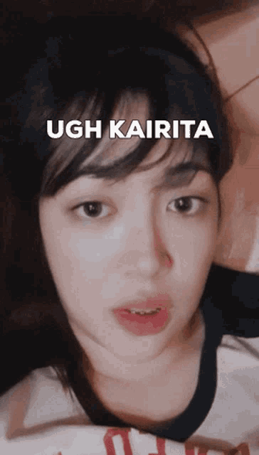 a woman laying down with the words ugh kairita above her face