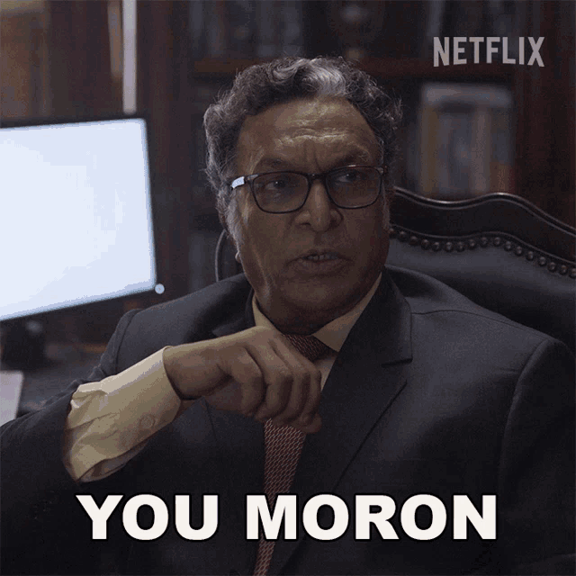 a man in a suit and tie says you moron in front of a netflix logo