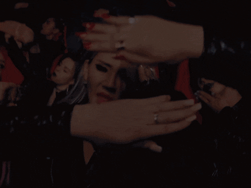 a woman says hello bitches in a crowd