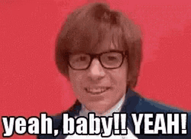 a man wearing glasses is making a funny face and saying yeah , baby ! yeah !