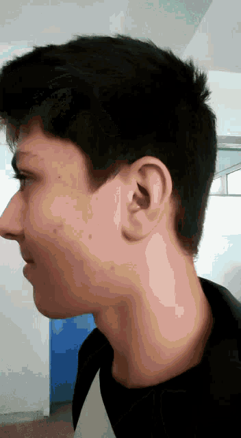 a close up of a person 's ear and neck
