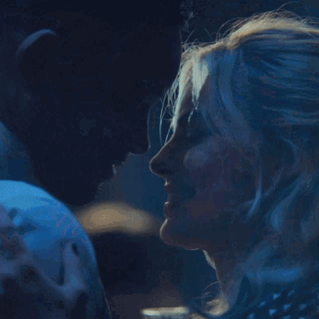 a close up of a man and woman dancing