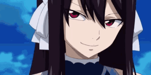 a girl with long black hair and red eyes is smiling for the camera .