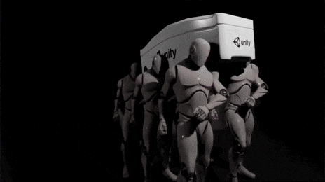 a group of mannequins are standing next to each other in front of a white box .