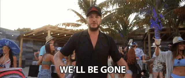 a man in a black shirt stands in front of a crowd and says we 'll be gone