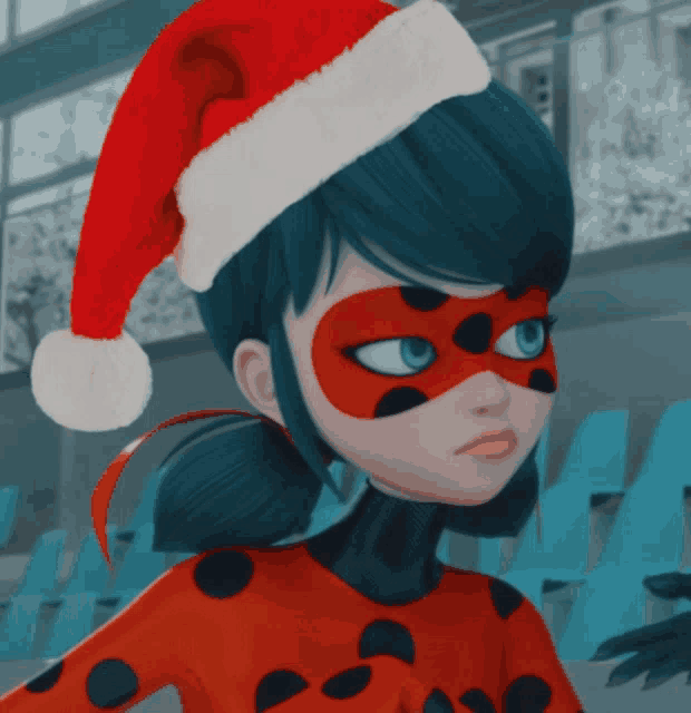 a ladybug wearing a santa hat and a red mask