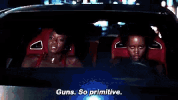 two people in a car with the words guns so primitive on the screen