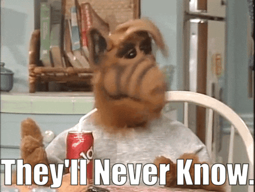 alf from the simpsons is sitting at a table with a can of diet coke