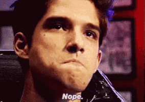 a close up of a man 's face with the words nope written on the bottom .