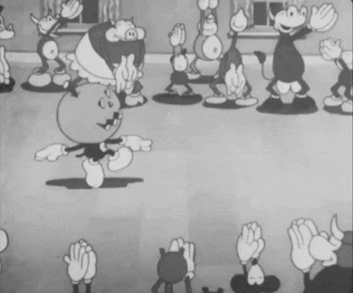 a group of cartoon characters are dancing together in a black and white photo