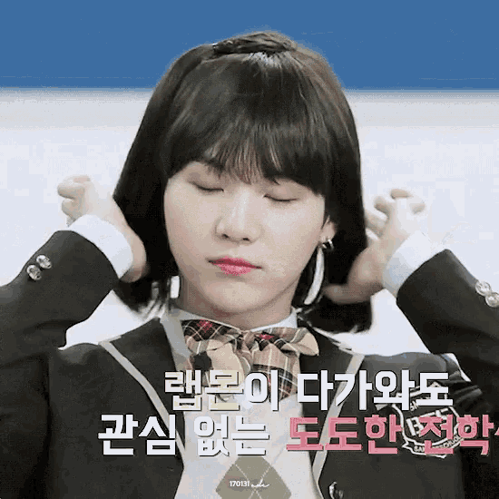 a girl in a school uniform with foreign writing on the bottom right
