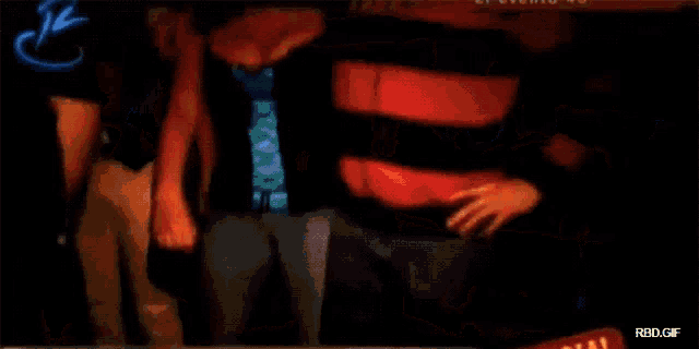 a blurry picture of a woman in a club with the words rbd.gif on the bottom