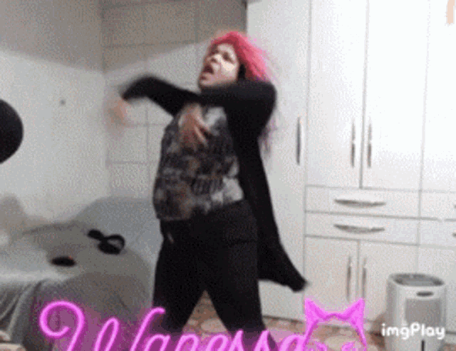 a woman with pink hair is dancing in a room with the words imgplay on the bottom right