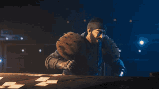 a man with a beard is playing a game of poker