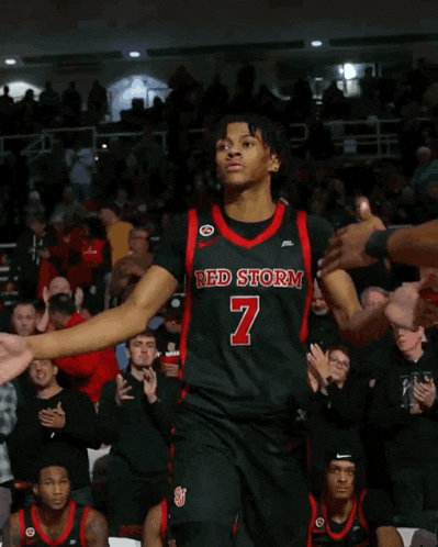 a basketball player wearing a red storm jersey number 7