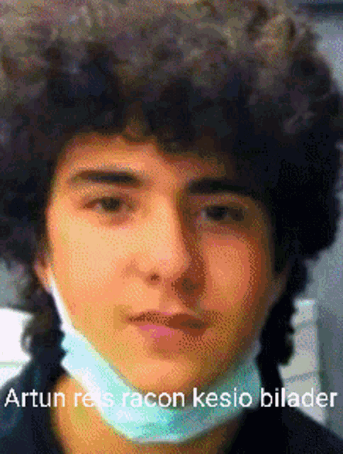 a young man wearing a face mask with the caption " artun reis racon kesio bilader " on the bottom