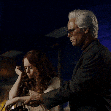 a man and woman are standing next to each other
