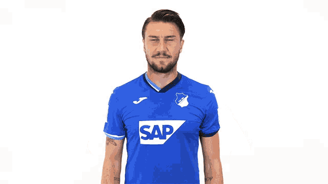 a man in a blue shirt that says sap on it