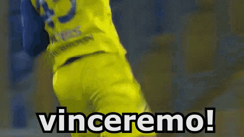 a soccer player in a yellow jersey with the word vinceremo on the bottom
