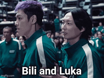 a man with purple hair is standing next to a man with black hair and the words " bili and luka " on the bottom