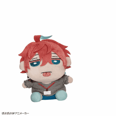 a stuffed animal with red hair and blue eyes is sitting on a white surface