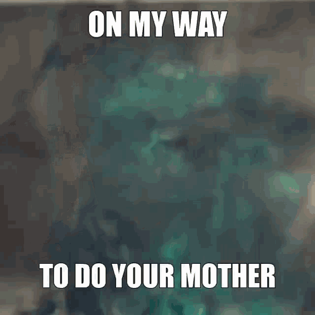 a man in a hooded jacket with the words `` on my way to do your mother '' written on the back of his head .