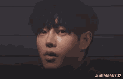 a close up of a person 's face with judleklek702 written below it
