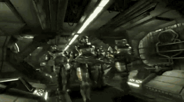 a group of soldiers are standing in a dark room with a vault door open .